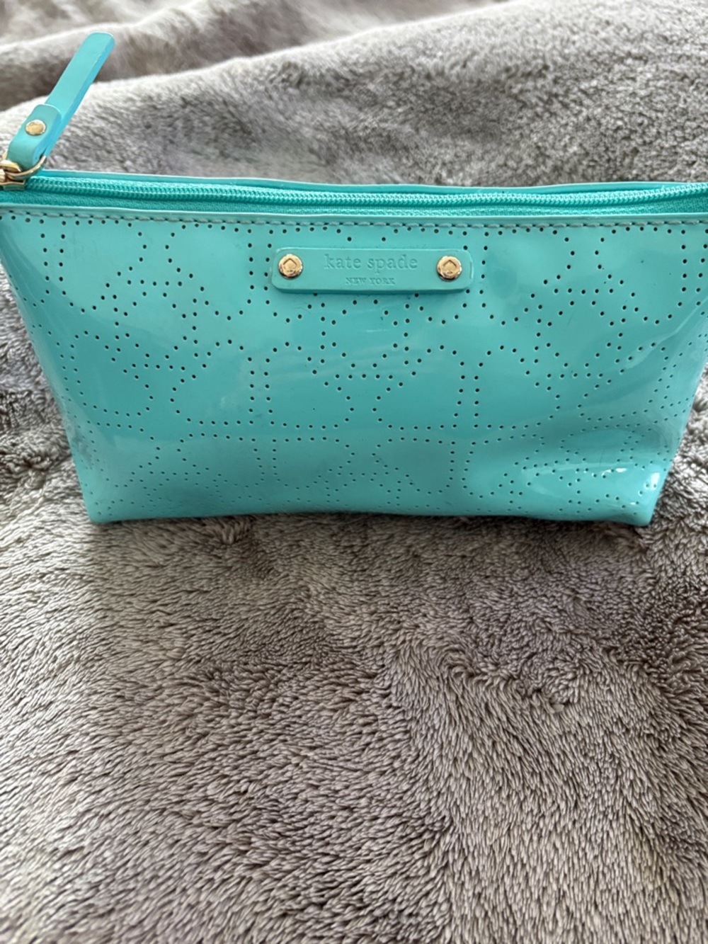 kate spade glossy aqua cosmetic pouch with perforated logo